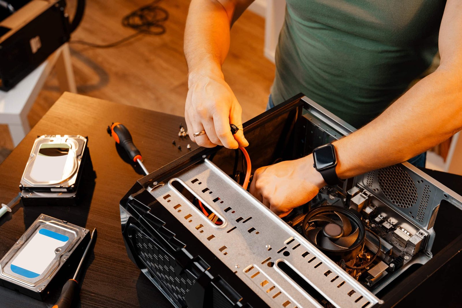 Close up of man repairing computer system unit